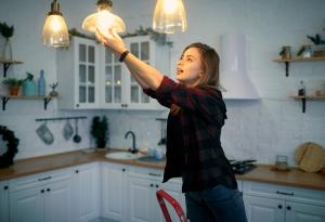 Woman, Changing Lightbulb, Home Maintenance