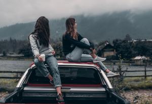 Two Women, Sitting, Outdoors, Car Roof